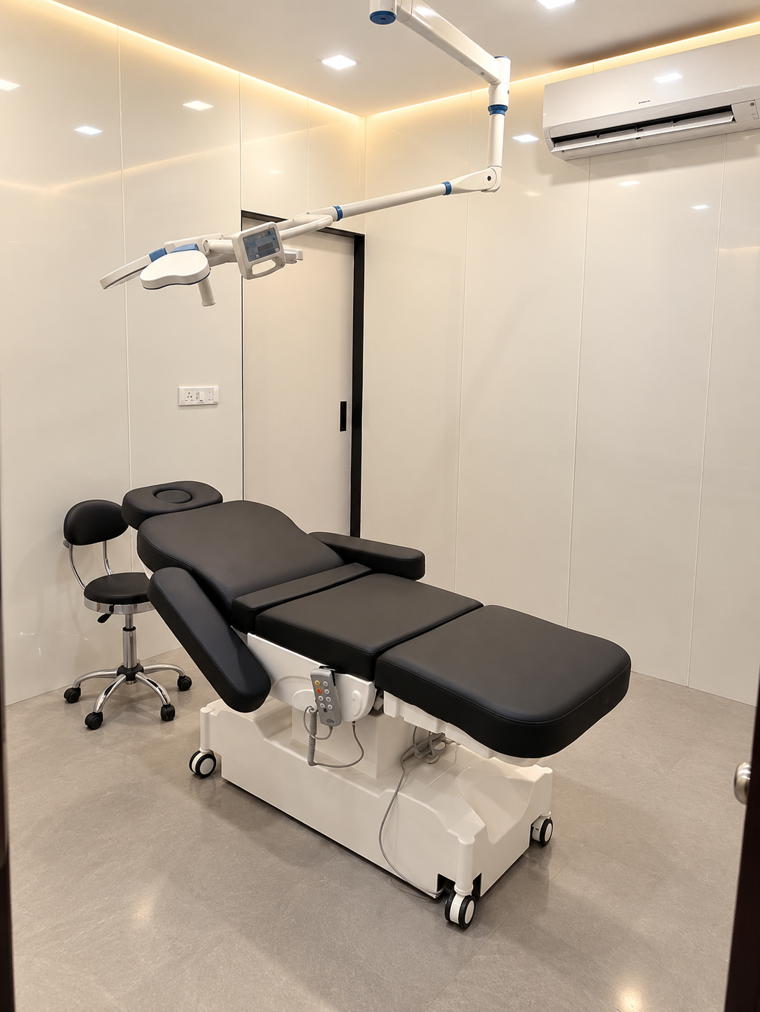 Procedure room with an adjustable treatment bed and overhead light
